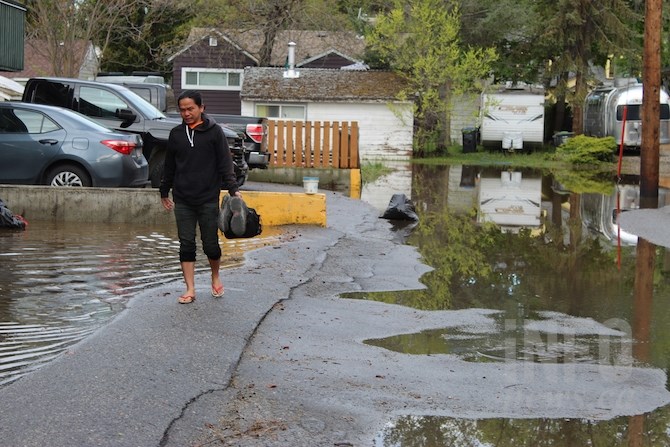 This man had to wade through the foul smelling and very cold water to get to his truck parked behind the Shaughnessy so he could drive to work. His unit was higher up in the building so he was not flooded.