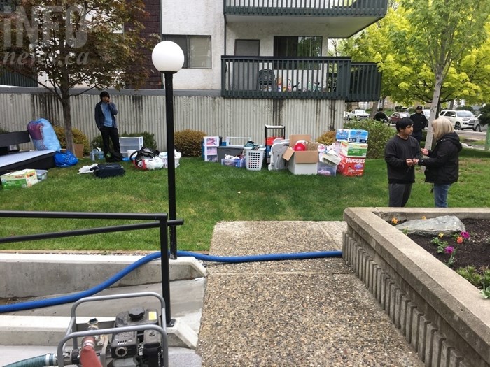 Residents of the Shaughnessy trying to figure out what to do next after they've removed some belongings and the ground floor is pumped out. 