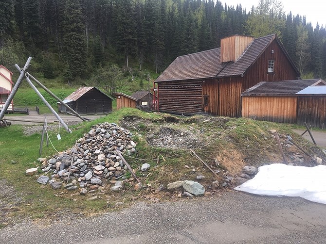 The garbage pit beside a replica of the original restaurant.