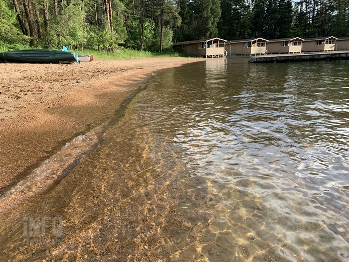 The property includes several lakeside cabins.