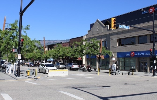 Even though Bernard Avenue was blocked off at Water Street, cars and motorcycle were still parked there.