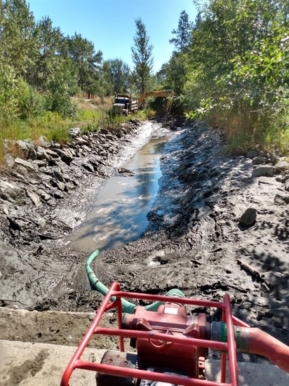 Pumping out the settling pond.