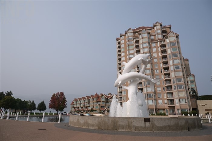 A smoky screen hangs behind the Dolphins statue in Kelowna.