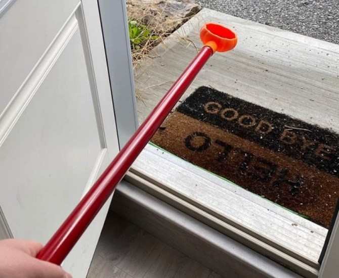 The idea is that candy can be placed in the bowl and extended to the treat-seeker, providing a socially distanced way to trick-or-treat.