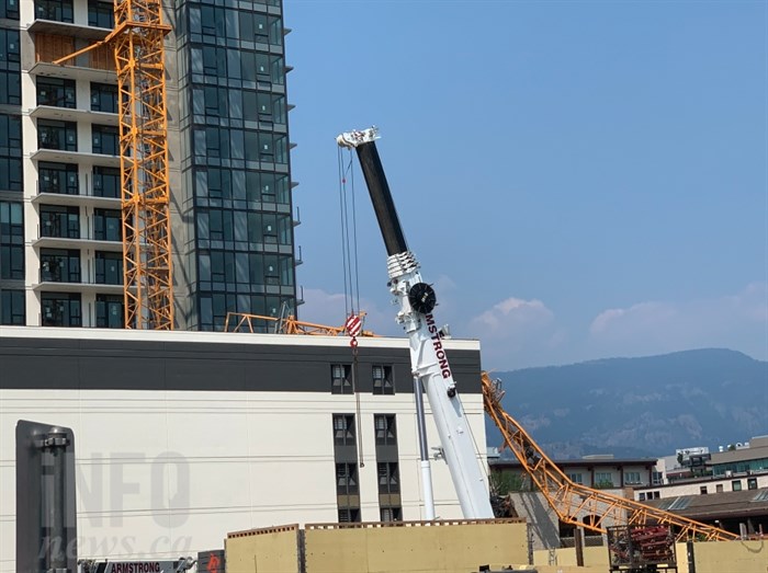 A witness said she saw a worker escape through the yellow structure attached to the building the background.