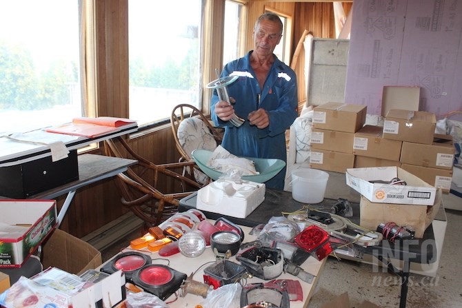 Grelecki shows some of the bathroom fixtures he's bought over the years.