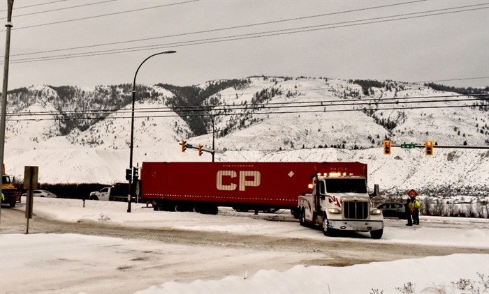 A heavy wrecker tow truck hooked up to remove a trailer after the Highway 1 and Grand Boulevard collision on Jan. 6, 2022.