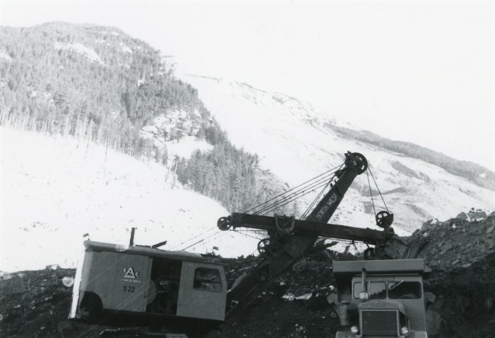 Emil Anderson Construction lends machinery and manpower to help clear a new path through the debris field.