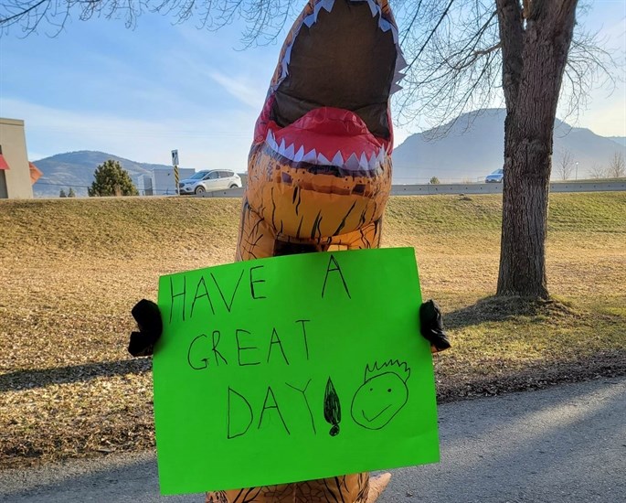 Kamloops kid, Wyatt Galbraith in a dinosaur outfit on Overlanders Bridge.