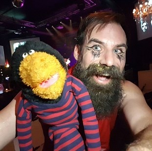 Arron Butowski poses with Air Guitar Canada judge Cozy Balboa.