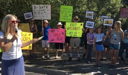 Protestors at a rally for the BX Creek wetland trail. 