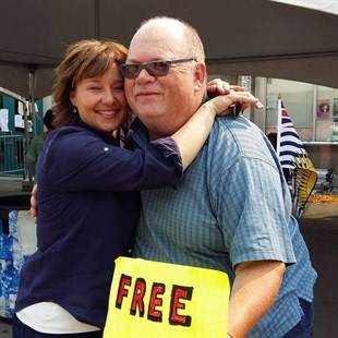 Elmer King giving former B.C. Premier Christy Clark a free hug.