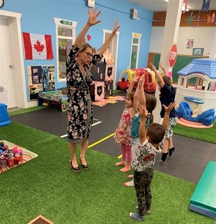 Mrs. Tamara Kayle with pre-school students.